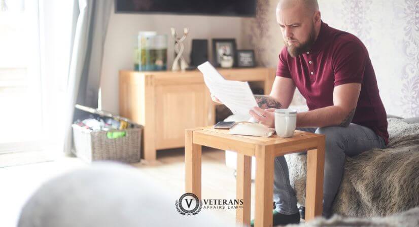 veterans looking at paperwork